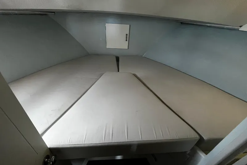 Slide: The Image of 1974 Tollycraft 37 Convertible cabin interior with cushioned sleeping area. - 39
