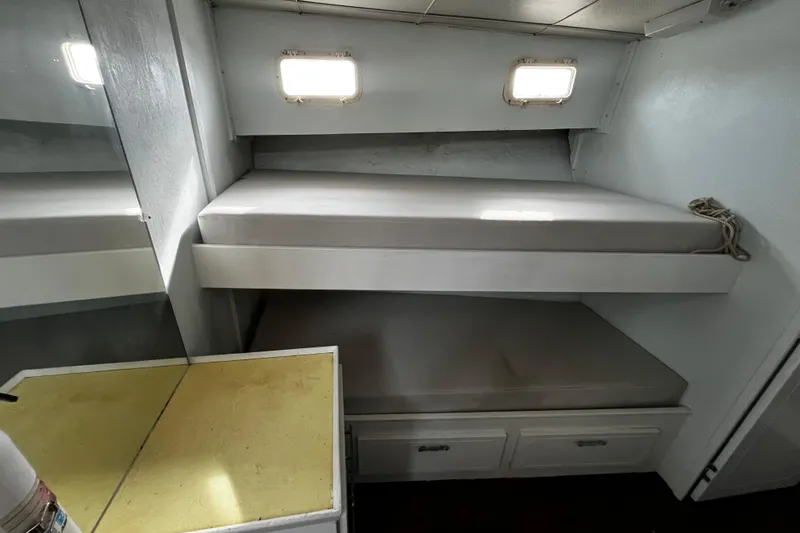 Slide: The Image of 1974 Tollycraft 37 Convertible cabin with bunk beds and storage drawers. - 34