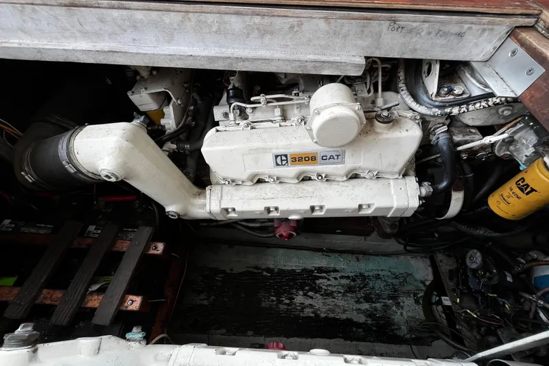 Slide: The Image of Engine compartment of a 1974 Tollycraft 37 Convertible with CAT 3208 engine. - 42