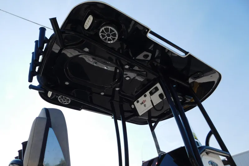 Slide: The Image of 2021 Sea Pro 219 Center Console T-top with speakers and electronics, viewed from below. - 11