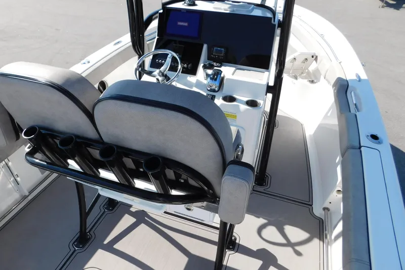 Slide: The Image of 2021 Sea Pro 219 Center Console boat interior with helm and seating area. - 12