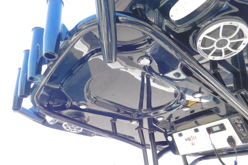 Slide: The Image of 2021 Sea Pro 219 Center Console boat's overhead view with speakers and rod holders. - 14