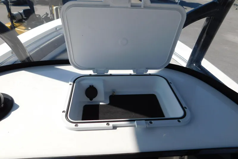 Slide: The Image of Open storage compartment on 2021 Sea Pro 219 Center Console boat. - 19
