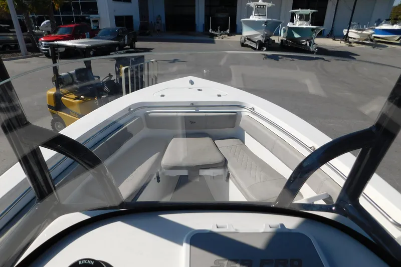 Slide: The Image of 2021 Sea Pro 219 Center Console boat interior with seating and console view. - 20