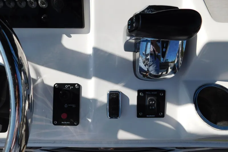 Slide: The Image of 2021 Sea Pro 219 Center Console boat controls with throttle and switches. - 24