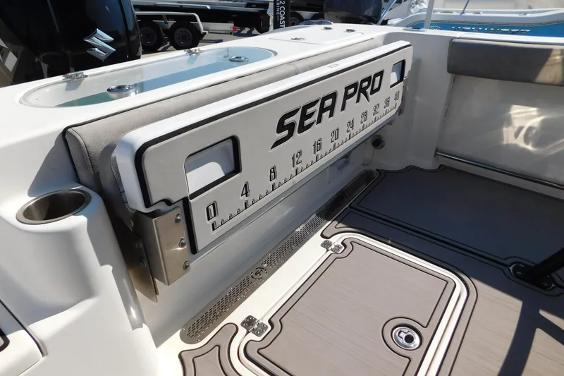 Slide: The Image of 2021 Sea Pro 219 Center Console boat interior with measuring board and storage. - 26