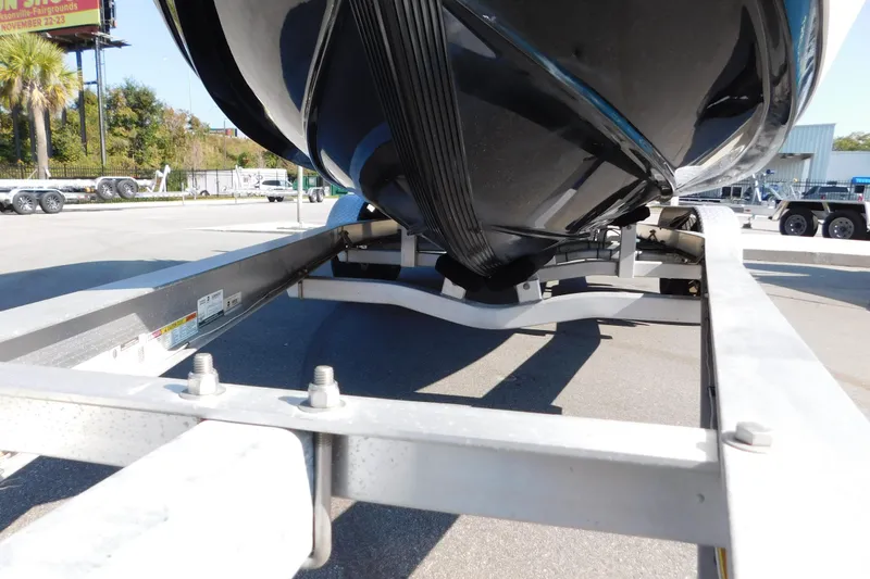 Slide: The Image of 2021 Sea Pro 219 Center Console boat on a trailer, viewed from below. - 3
