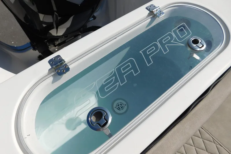 Slide: The Image of 2021 Sea Pro 219 Center Console livewell with clear lid and secure latches. - 30