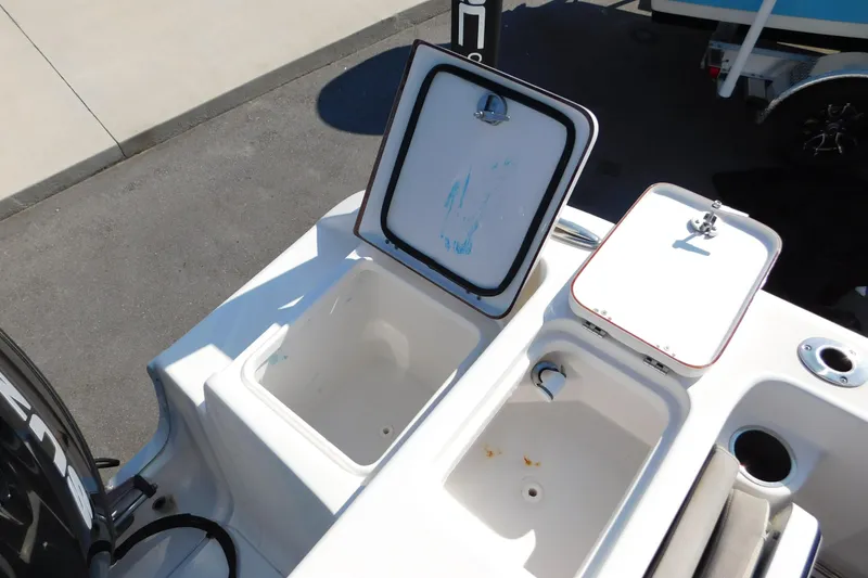 Slide: The Image of 2021 Sea Pro 219 Center Console boat with open storage compartments. - 31