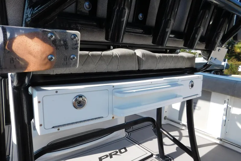 Slide: The Image of 2021 Sea Pro 219 Center Console boat interior with storage compartments and seating. - 33