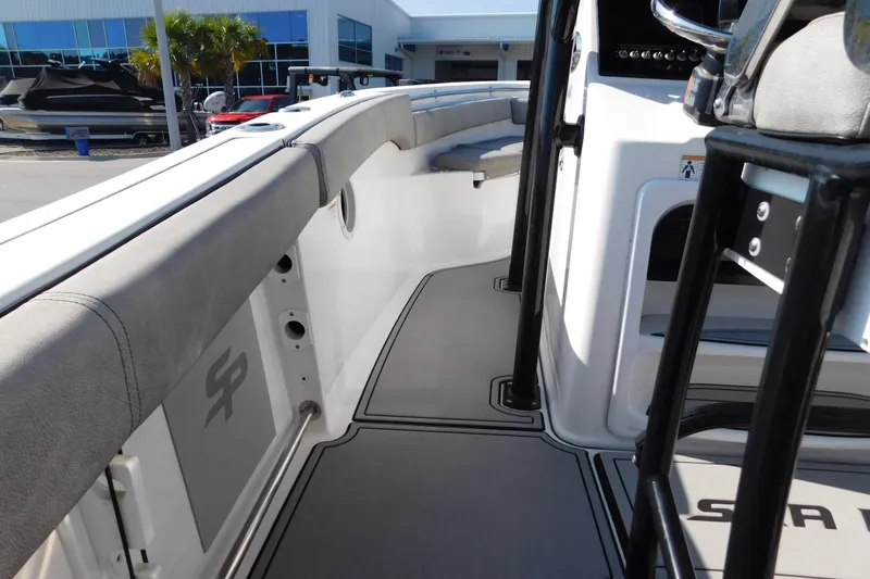 Slide: The Image of 2021 Sea Pro 219 Center Console boat interior with cushioned seating and modern design. - 34