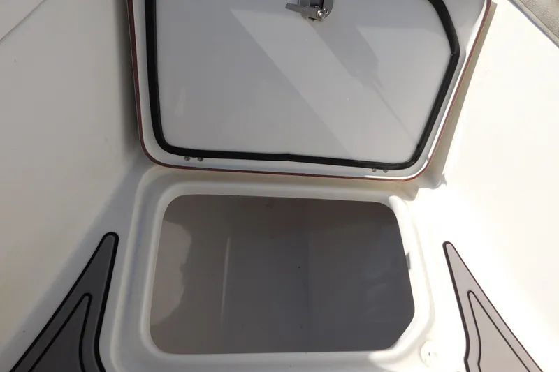 Slide: The Image of Open storage compartment on a 2021 Sea Pro 219 Center Console boat. - 40