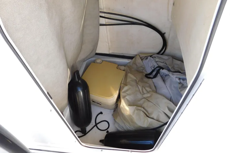 Slide: The Image of Storage compartment of 2021 Sea Pro 219 Center Console boat with equipment and cover. - 41