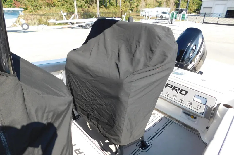 Slide: The Image of 2021 Sea Pro 219 Center Console boat with covered console and Suzuki outboard motor. - 47