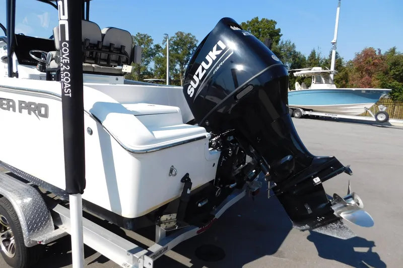 Slide: The Image of 2021 Sea Pro 219 Center Console boat with Suzuki outboard motor on trailer. - 5