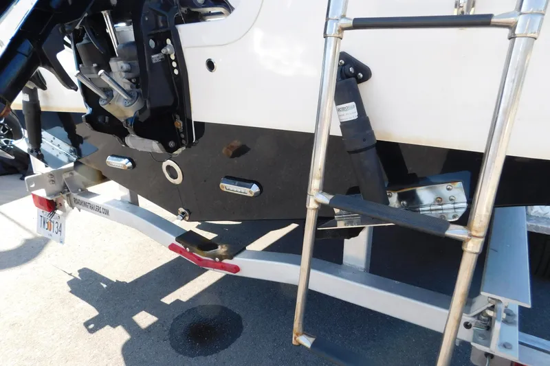 Slide: The Image of 2021 Sea Pro 219 Center Console boat with ladder and trailer detail. - 7