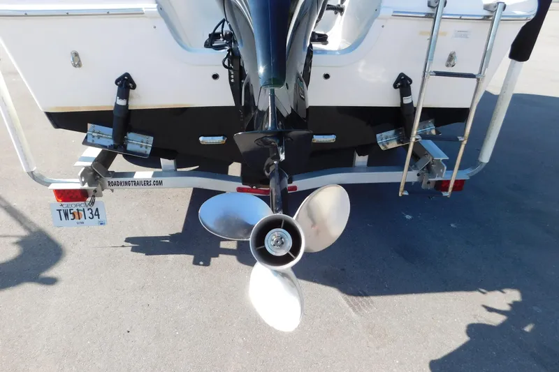 Slide: The Image of Rear view of 2021 Sea Pro 219 Center Console boat on trailer, showing propeller and ladder. - 8
