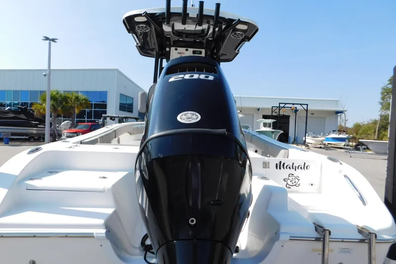 Slide: The Image of 2021 Sea Pro 219 Center Console boat with powerful outboard motor, docked at marina. - 9