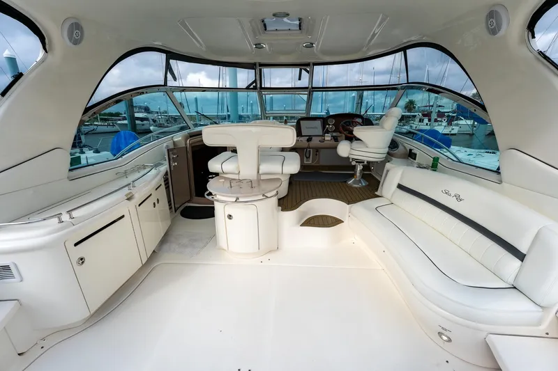 Slide: The Image of Helm of 2005 Sea Ray 500 Sundancer with Garmin navigation system and luxurious controls. - 13