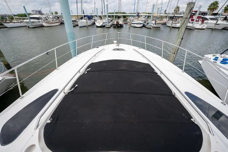 Slide: The Image of 2005 Sea Ray 500 Sundancer yacht docked at marina with sailboats. - 23