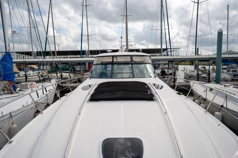 Slide: The Image of Luxurious interior of 2005 Sea Ray 500 Sundancer yacht with elegant seating and kitchen area. - 24