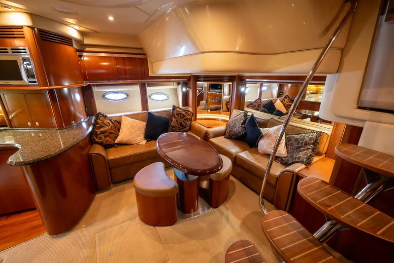 Slide: The Image of Luxurious 2005 Sea Ray 500 Sundancer yacht interior with modern kitchen and elegant wood finishes. - 26