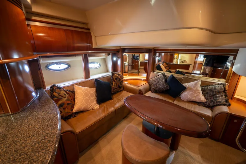 Slide: The Image of Luxurious interior of 2005 Sea Ray 500 Sundancer yacht with wooden cabinetry and modern amenities. - 29