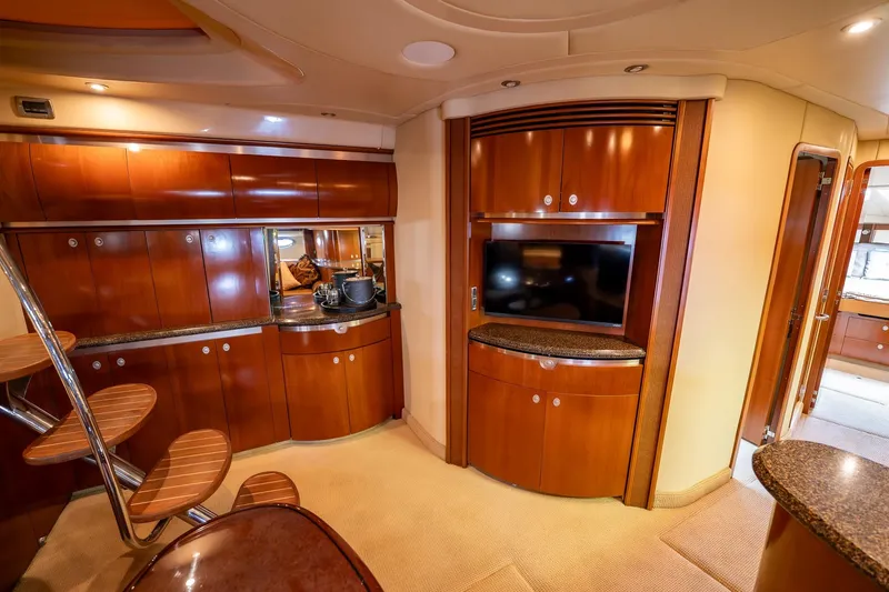 Slide: The Image of Luxurious kitchen interior of 2005 Sea Ray 500 Sundancer yacht with wood cabinetry. - 30