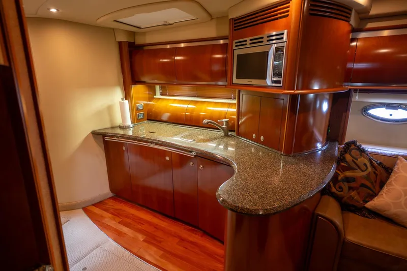 Slide: The Image of Luxurious kitchen area in a 2005 Sea Ray 500 Sundancer yacht with modern amenities. - 31