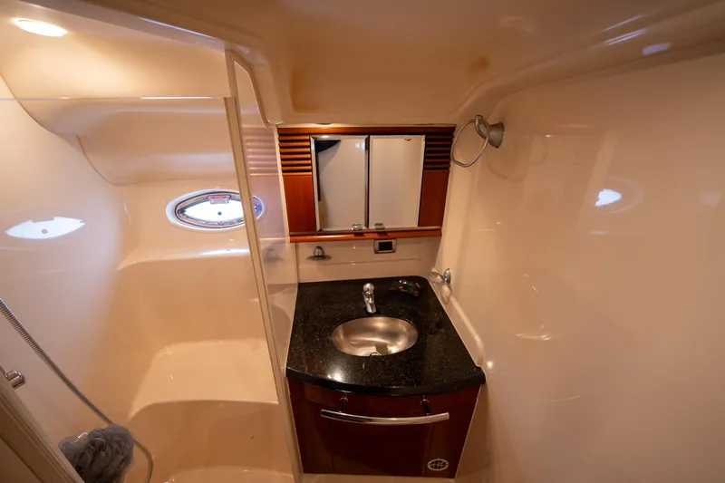 Slide: The Image of Luxurious cabin interior of 2005 Sea Ray 500 Sundancer yacht with elegant bedding. - 38