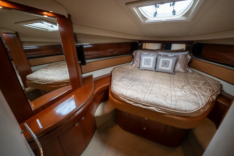 Slide: The Image of Luxurious cabin interior of 2005 Sea Ray 500 Sundancer yacht with cozy bedding. - 39