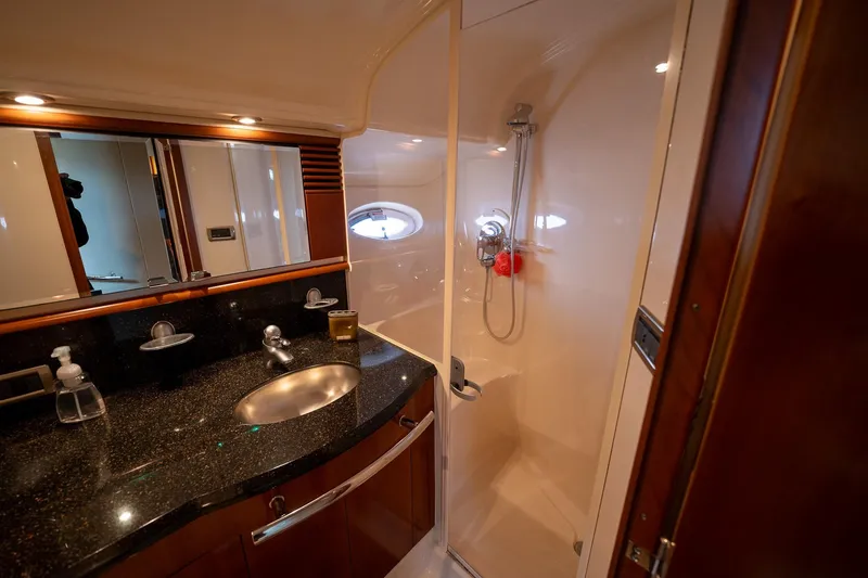 Slide: The Image of Luxurious interior of 2005 Sea Ray 500 Sundancer yacht with modern kitchen and cozy seating area. - 43