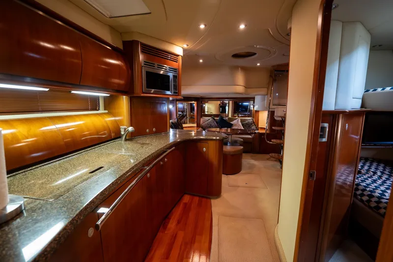 Slide: The Image of Compact washer-dryer unit inside a 2005 Sea Ray 500 Sundancer yacht cabinet. - 44