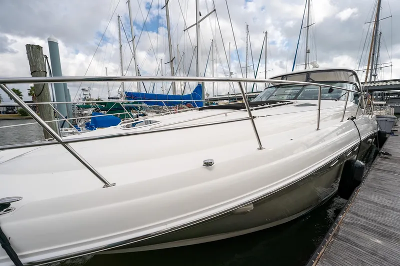 Slide: The Image of 2005 Sea Ray 500 Sundancer yacht with spacious cockpit and luxurious seating at marina. - 7