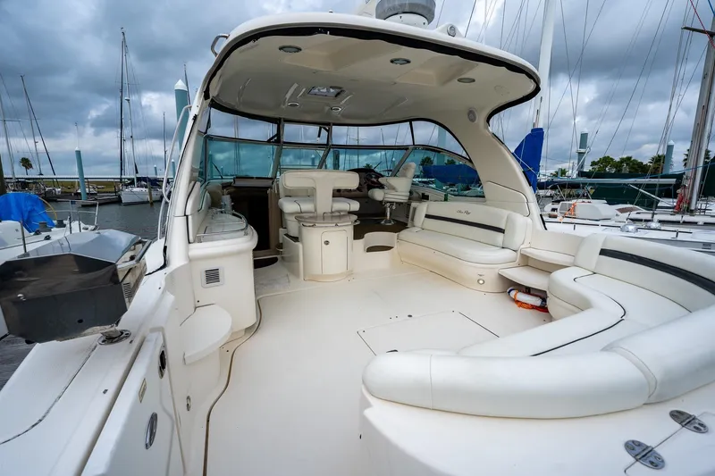 Slide: The Image of Luxurious 2005 Sea Ray 500 Sundancer yacht with spacious seating at marina. - 8