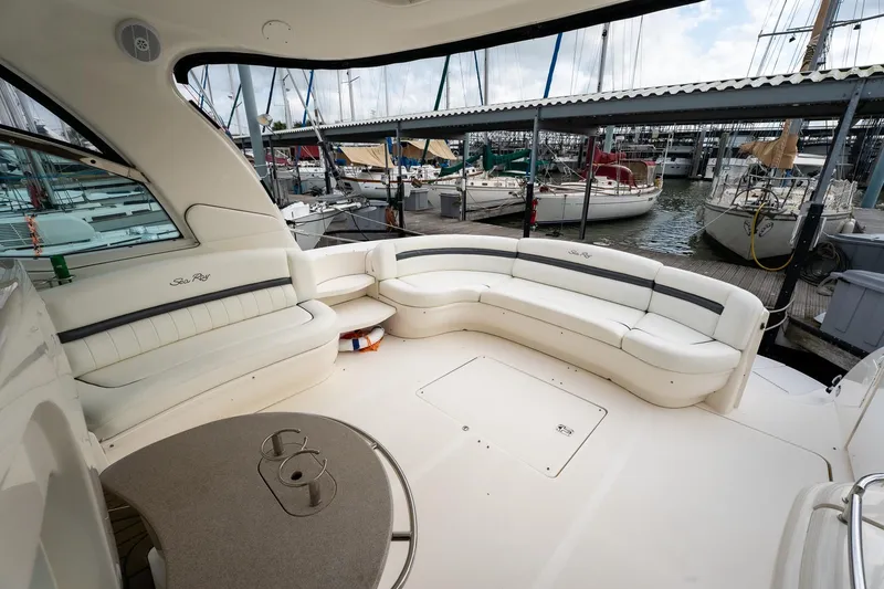 Slide: The Image of Luxurious 2005 Sea Ray 500 Sundancer yacht interior with spacious seating at marina. - 9