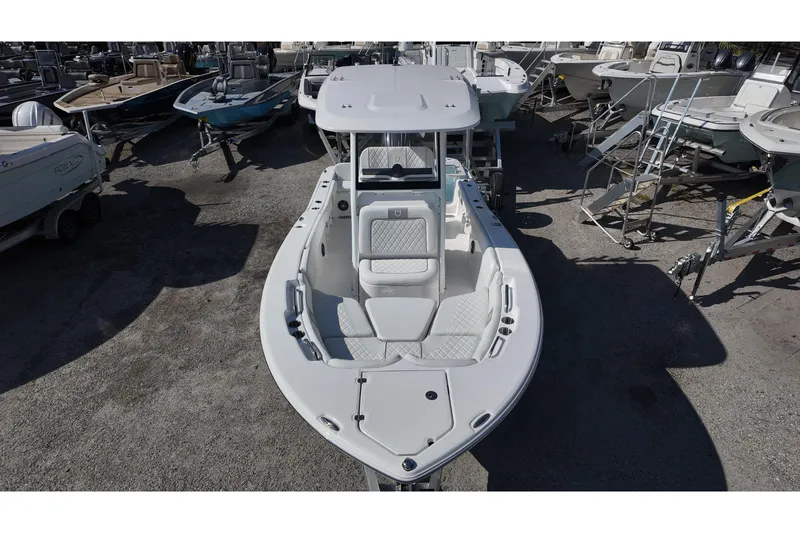 Slide: The Image of 2026 Sea Fox 228 Commander boat displayed in a marina, showcasing sleek design and seating. - 10