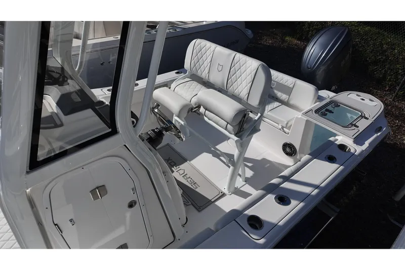 Slide: The Image of 2026 Sea Fox 228 Commander boat interior with white seating and modern design. - 12