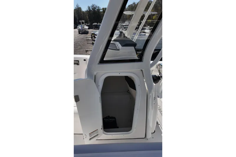 Slide: The Image of 2026 Sea Fox 228 Commander boat interior cabin view with open door. - 13