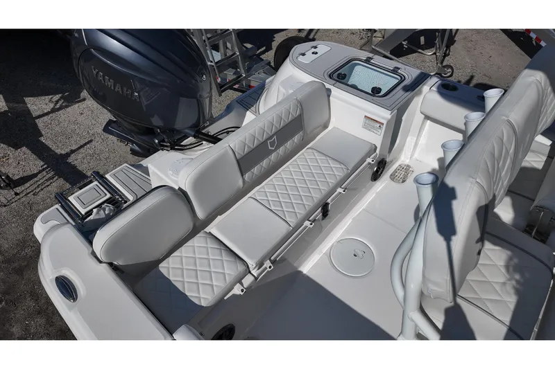 Slide: The Image of 2026 Sea Fox 228 Commander boat interior with Yamaha engine, featuring cushioned seating and storage. - 16