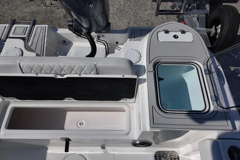 Slide: The Image of 2026 Sea Fox 228 Commander boat interior with storage compartments and seating. - 17