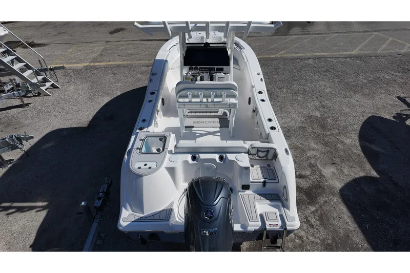 Slide: The Image of 2026 Sea Fox 228 Commander boat, aerial view, showcasing deck layout and engine. - 18