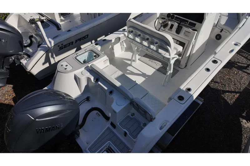 Slide: The Image of 2026 Sea Fox 228 Commander boat interior with Yamaha engine, featuring seating and control console. - 5