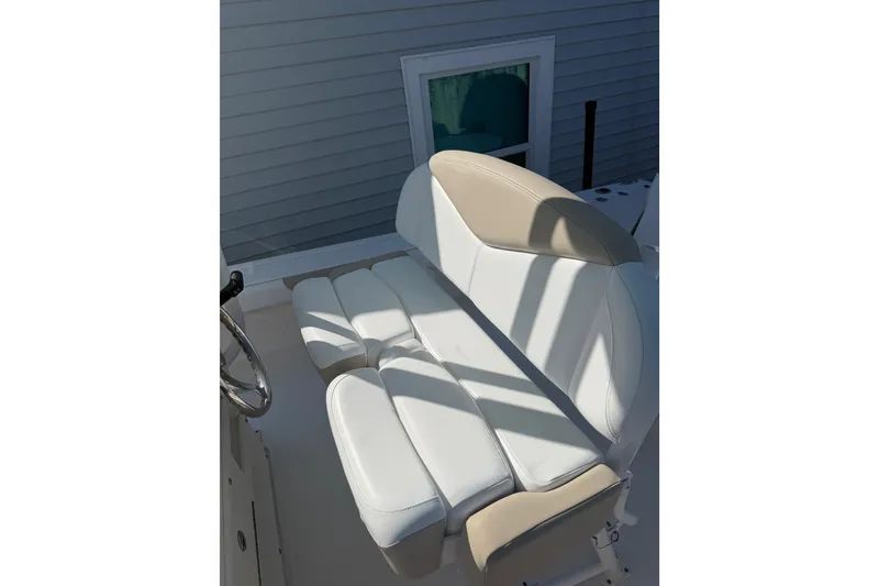 Slide: The Image of 2018 Robalo 226 Cayman boat seat with white and beige upholstery. - 12