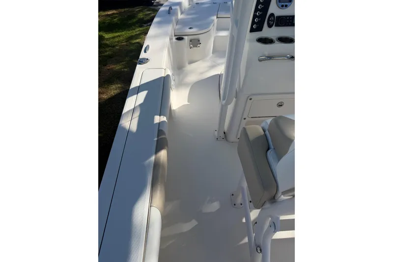 Slide: The Image of 2018 Robalo 226 Cayman boat interior with seating and console view. - 16