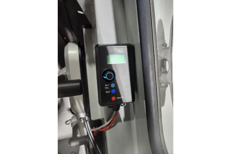 Slide: The Image of Control panel on 2024 Hewescraft 180 Sportsman boat, featuring digital display and buttons. - 14