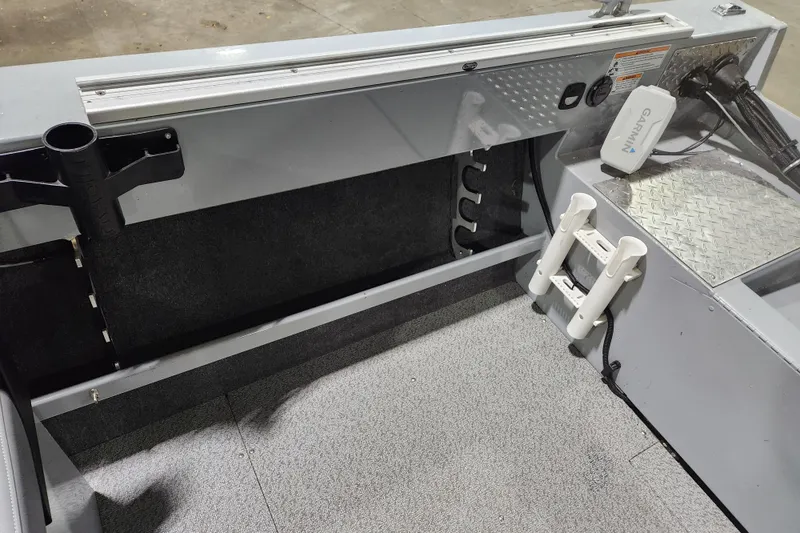 Slide: The Image of 2024 Hewescraft 180 Sportsman interior with rod holders and Garmin device. - 8