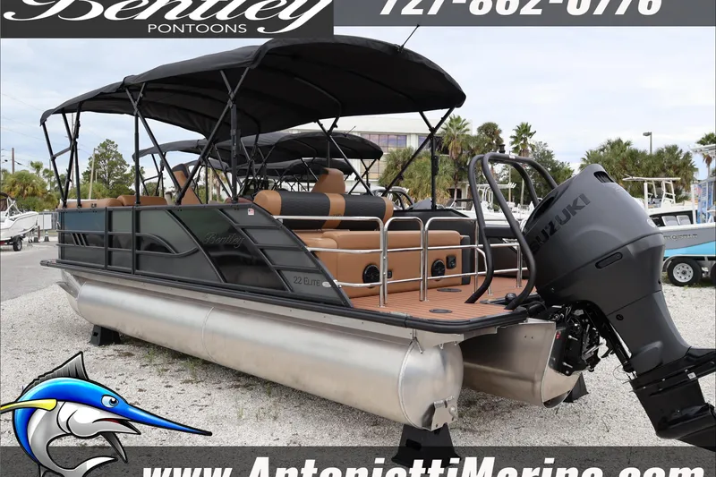 Slide: The Image of 2026 Bentley Pontoons Elite 223 Swingback Dual Capt with Suzuki engine, displayed outdoors. - 10