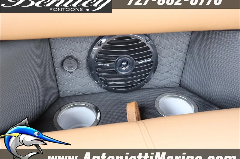 Slide: The Image of 2026 Bentley Pontoons Elite 223 interior with marine-grade speaker and USB port. - 13