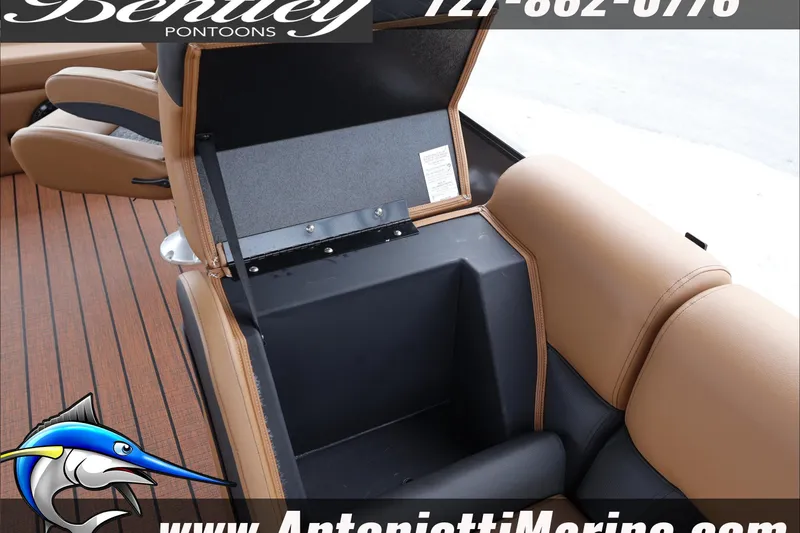 Slide: The Image of 2026 Bentley Pontoons Elite 223 Swingback interior storage compartment with tan leather seating. - 17